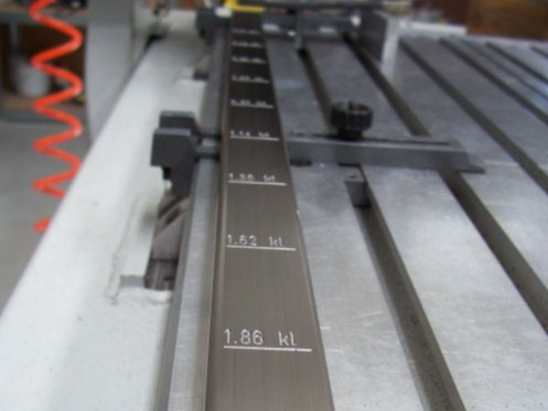 Engraved graduations on a metal machinery component
