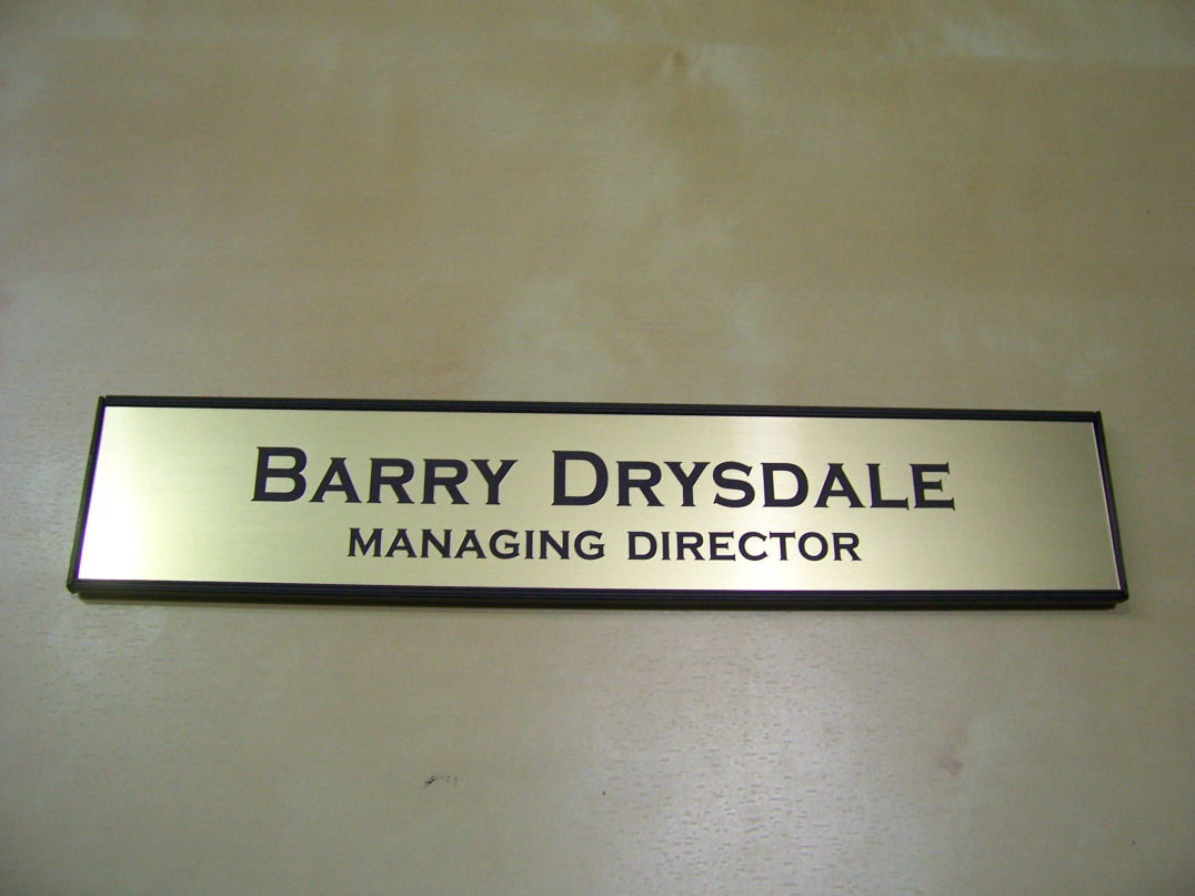 Deluxe wall & door name bar with black frame, black end caps and brushed gold name plate